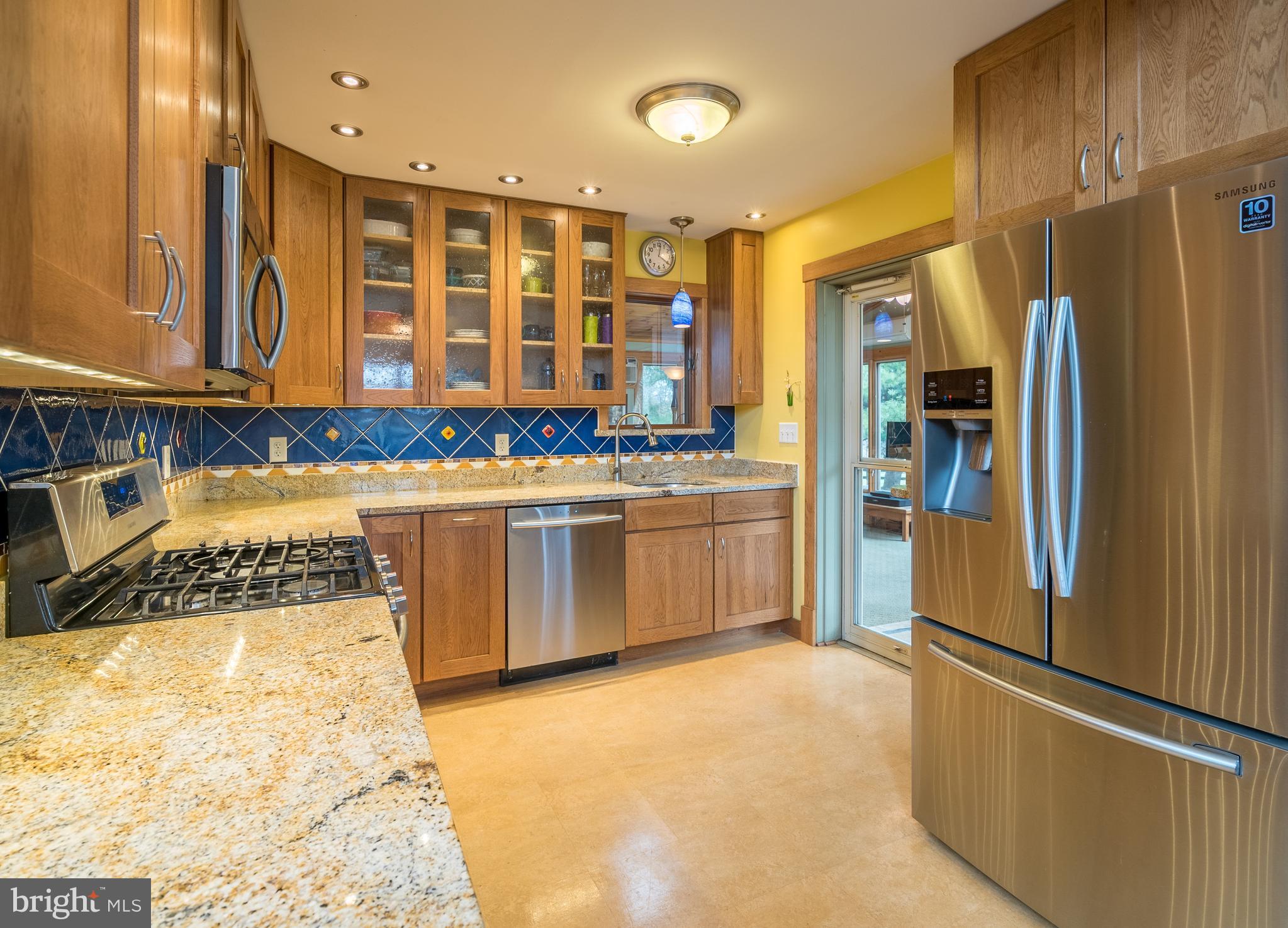 11850 Beaver Dam Road Union Bridge, MD 21791 - Photo 9 of 30 a kitchen with stainless steel appliances granite countertop a stove a sink and a refrigerator