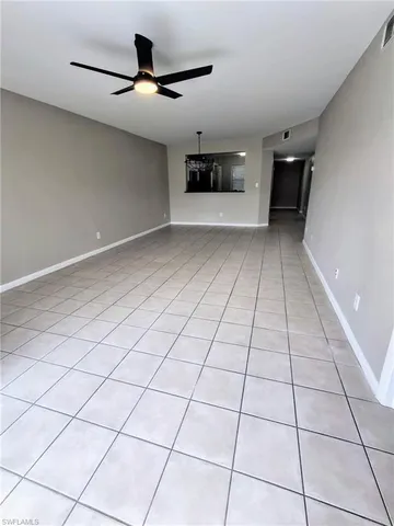 a view of an empty room and a window