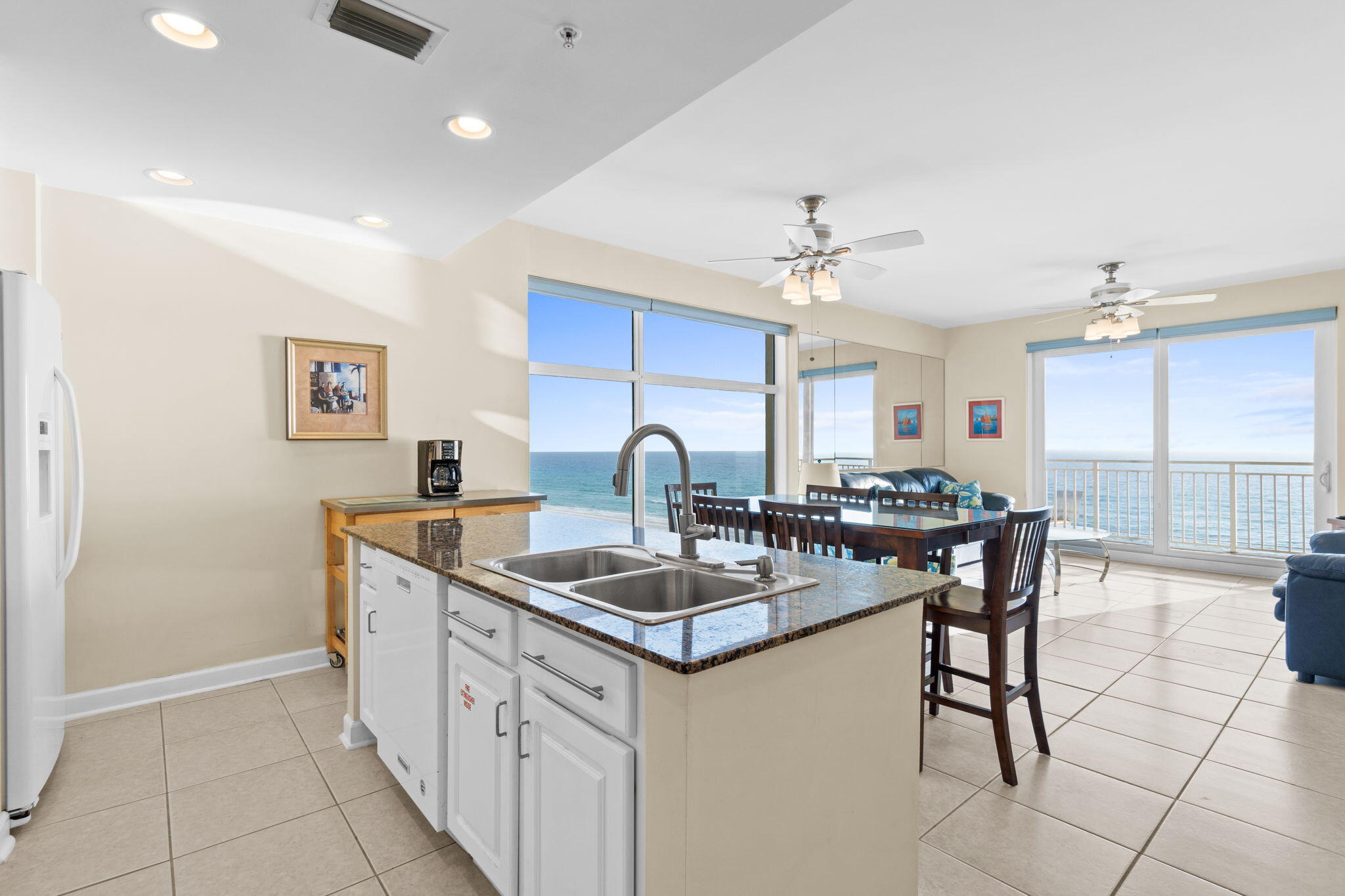 12011 Front Beach Road, Unit 201C Panama City Beach, FL 32407 - Photo 1 of 42 a kitchen with stainless steel appliances granite countertop a sink a stove and a refrigerator