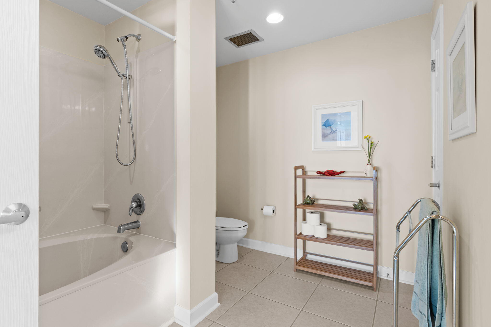 12011 Front Beach Road, Unit 201C Panama City Beach, FL 32407 - Photo 12 of 42 a bathroom with a granite countertop bathtub shower and toilet