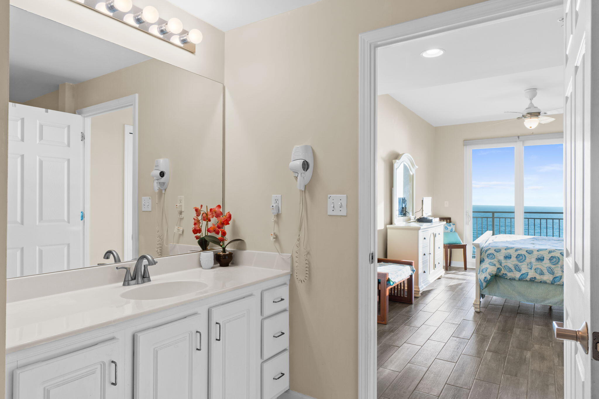 12011 Front Beach Road, Unit 201C Panama City Beach, FL 32407 - Photo 13 of 42 a en suite spacious bathroom with a double vanity sink and a mirror