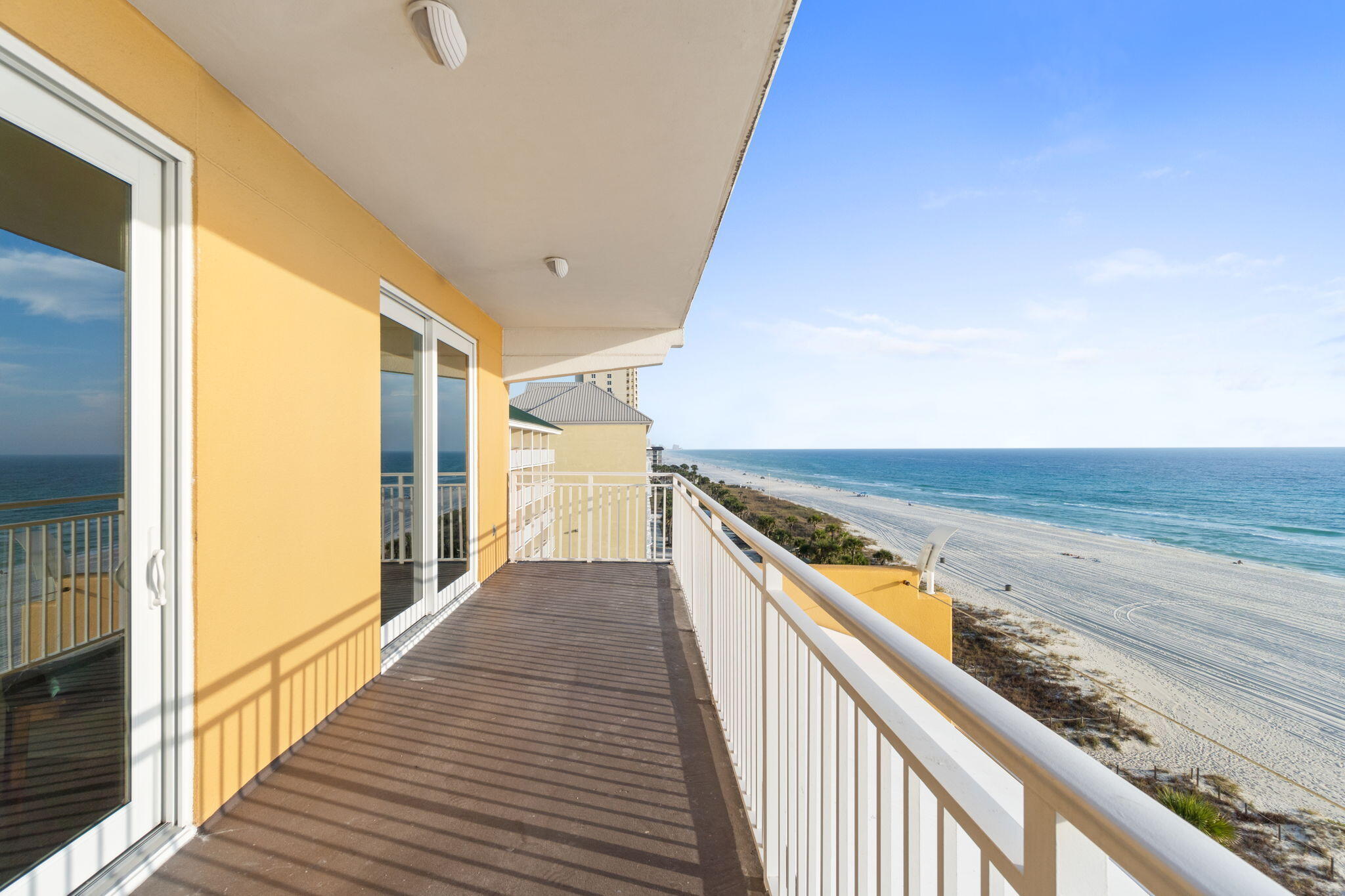 12011 Front Beach Road, Unit 201C Panama City Beach, FL 32407 - Photo 16 of 42 a view of a balcony with wooden floor