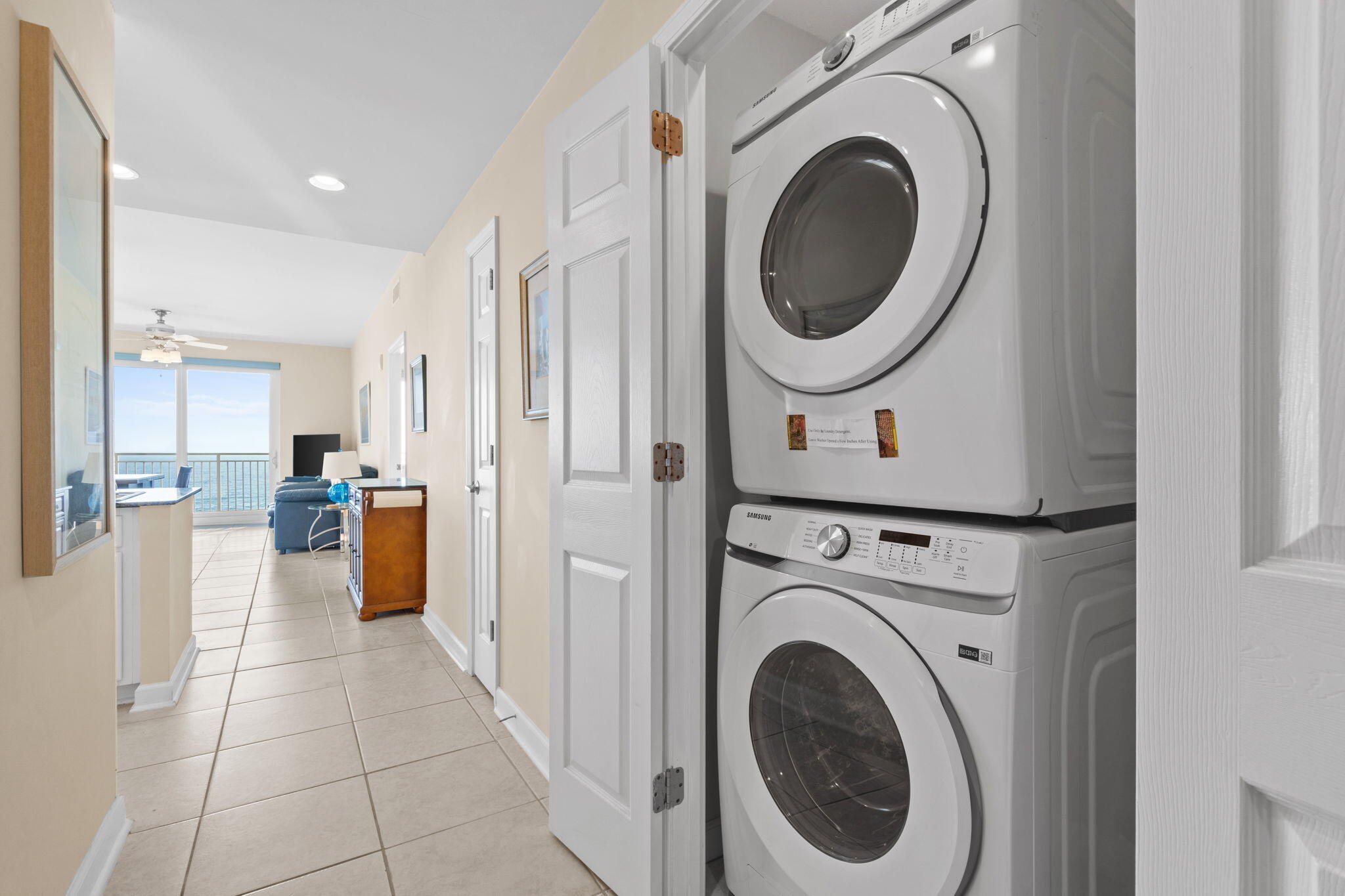 12011 Front Beach Road, Unit 201C Panama City Beach, FL 32407 - Photo 20 of 42 a view of a kitchen with a washer and dryer