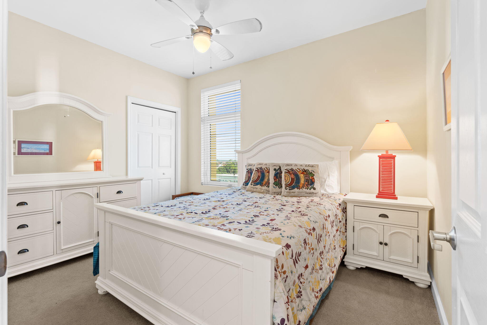 12011 Front Beach Road, Unit 201C Panama City Beach, FL 32407 - Photo 22 of 42 a bedroom with a bed and a dresser