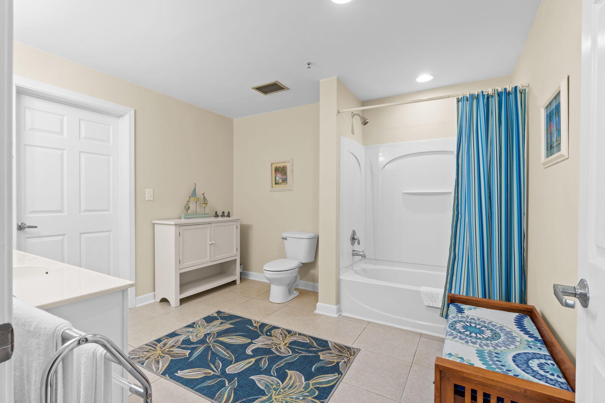 12011 Front Beach Road, Unit 201C Panama City Beach, FL 32407 - Photo 30 of 42 a bathroom with a sink toilet and shower