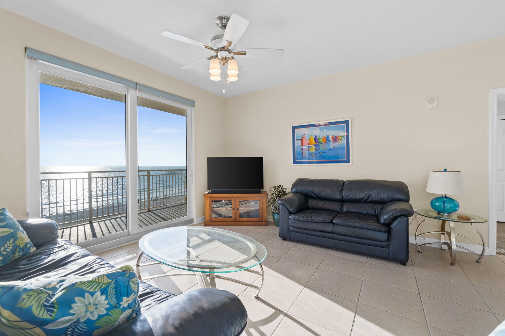 12011 Front Beach Road, Unit 201C Panama City Beach, FL 32407 - Photo 4 of 42 a living room with furniture and a flat screen tv