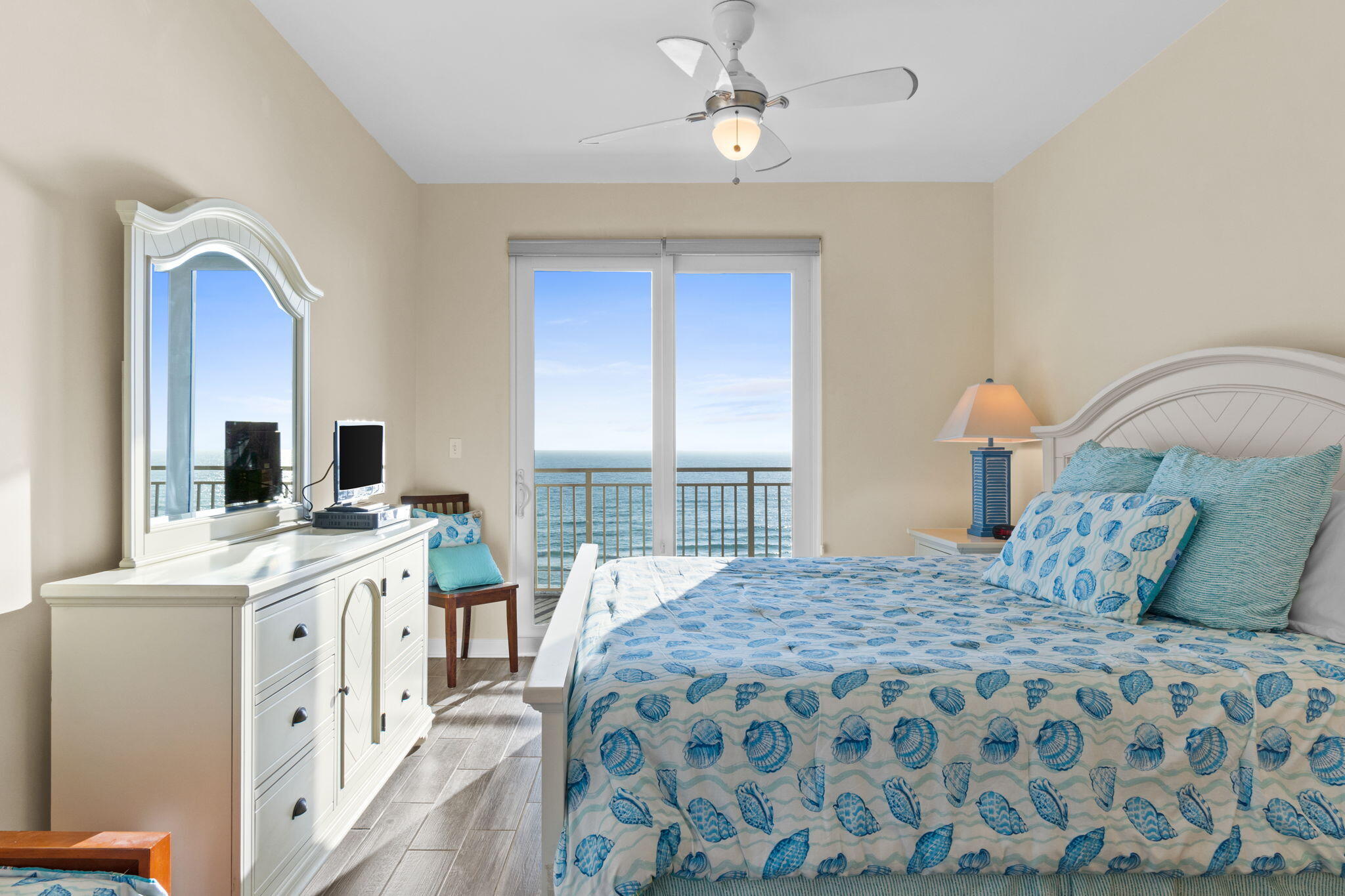 12011 Front Beach Road, Unit 201C Panama City Beach, FL 32407 - Photo 8 of 42 a bedroom with a large bed and a window