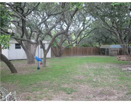 a backyard of a house with lots of green space