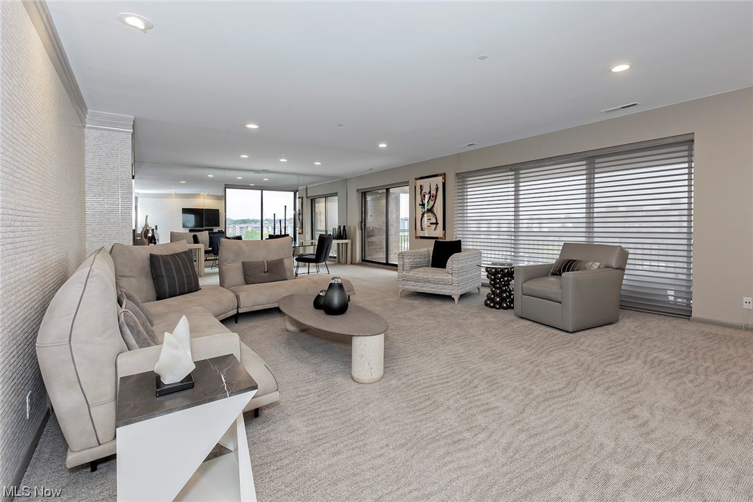 27500 Cedar Road, Unit 608 Beachwood, OH 44122 - Photo 4 of 34 Great room has floor to ceiling windows and sliding doors to allow plenty of natural daylight to shine in.