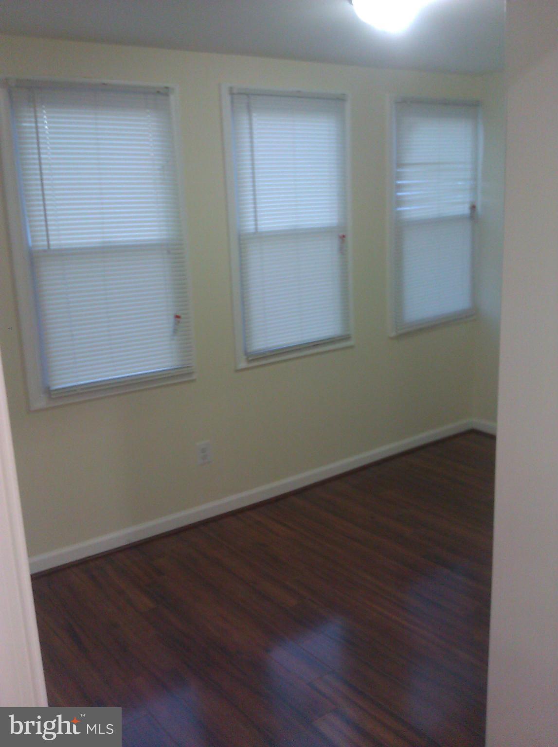 148 West Edgevale Road Baltimore, MD 21225 - Photo 6 of 12 wooden floor in an empty room