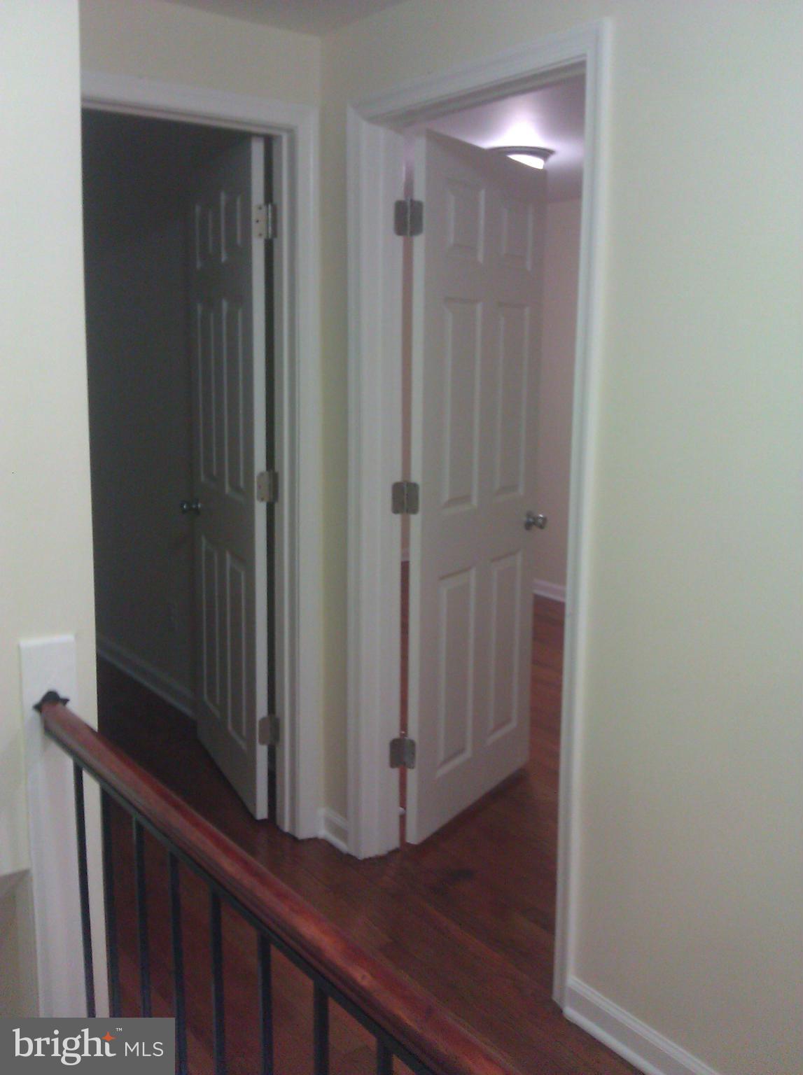 148 West Edgevale Road Baltimore, MD 21225 - Photo 8 of 12 a view of a hallway with wooden floor