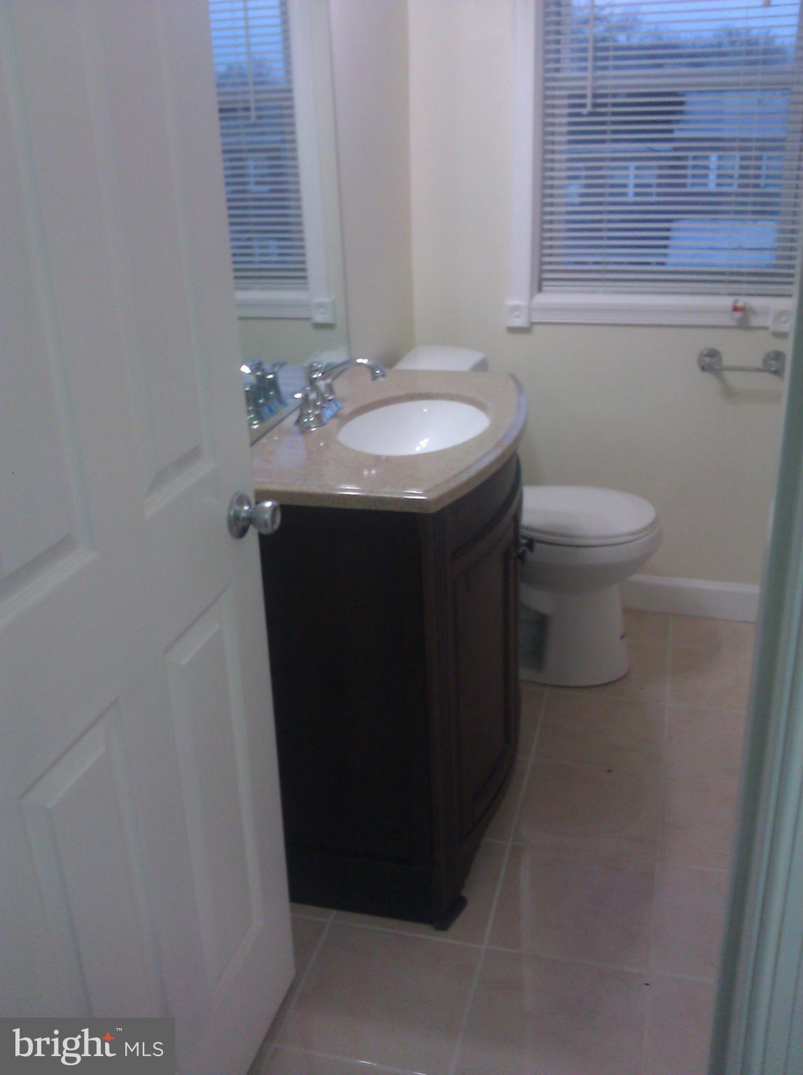 148 West Edgevale Road Baltimore, MD 21225 - Photo 10 of 12 a bathroom with a sink and a toilet