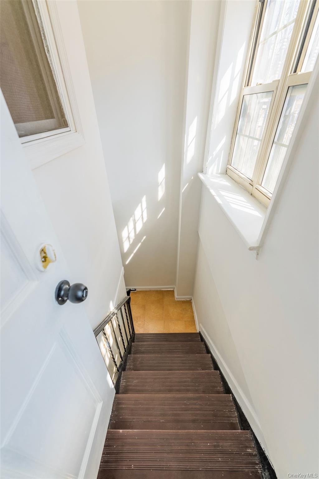 102-23 43rd Avenue, Unit 1B Queens, NY 11368 - Photo 16 of 18 a view of entryway and hall with wooden floor
