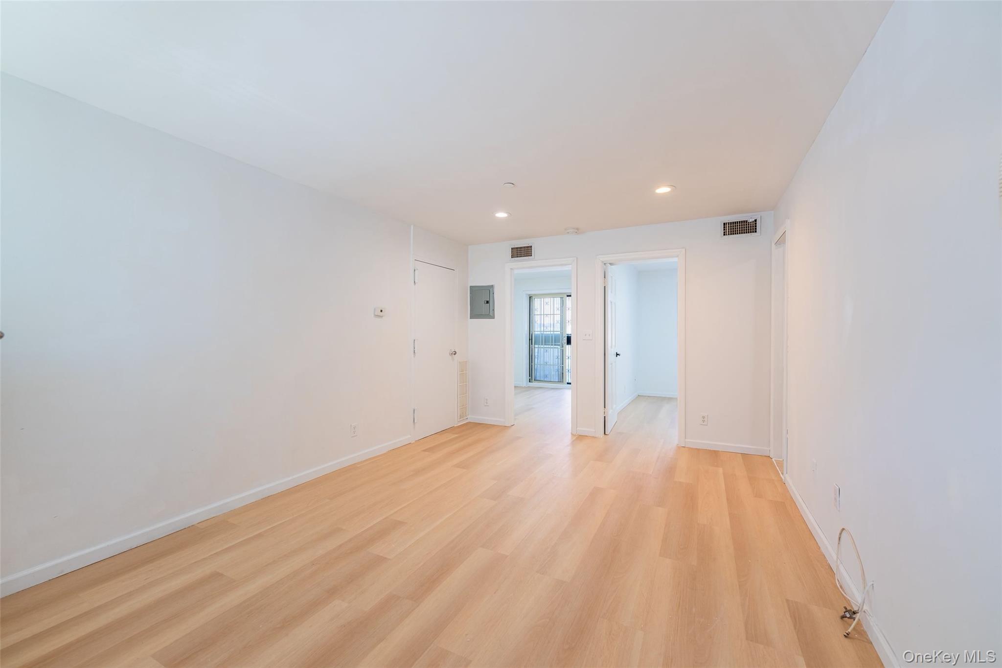 102-23 43rd Avenue, Unit 1B Queens, NY 11368 - Photo 6 of 18 a view of empty room with wooden floor