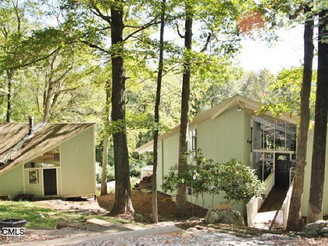 87 Millstone Road Wilton, CT 06897 - Photo 1 of 1 a front view of a house with garden