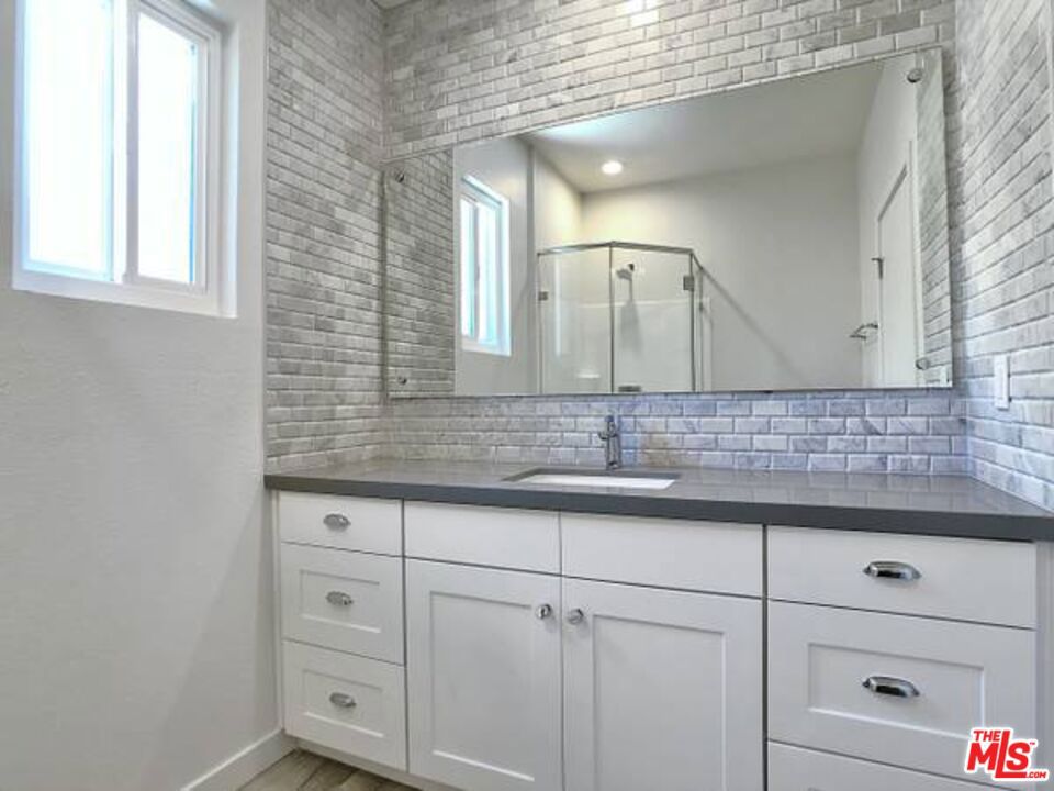 1900 Silver, Unit 104 Los Angeles, CA 90039 - Photo 12 of 21 a bathroom with a sink and a mirror
