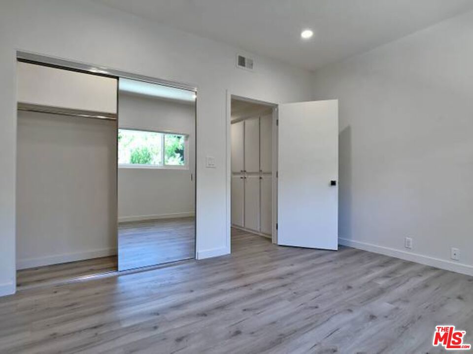 1900 Silver, Unit 104 Los Angeles, CA 90039 - Photo 14 of 21 an empty room with wooden floor & closet area