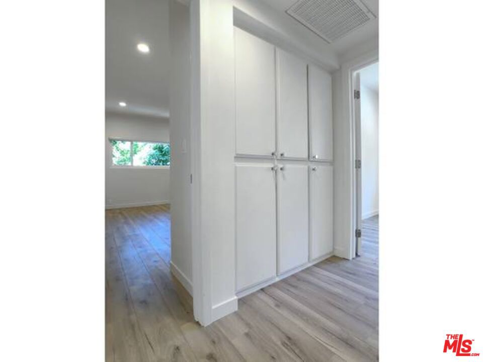 1900 Silver, Unit 104 Los Angeles, CA 90039 - Photo 16 of 21 a view of an empty room with wooden floor