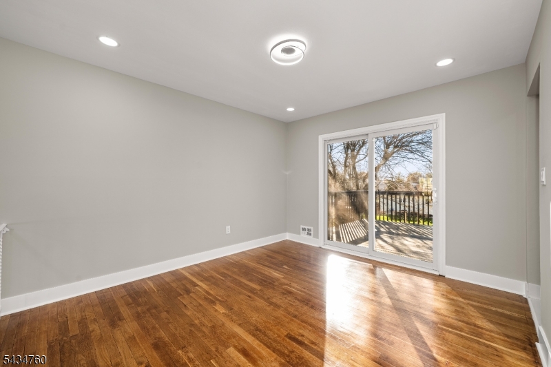 641 Ydv-ham Sq Road Robbinsville, NJ 08691 - Photo 22 of 49 an empty room with wooden floor and windows