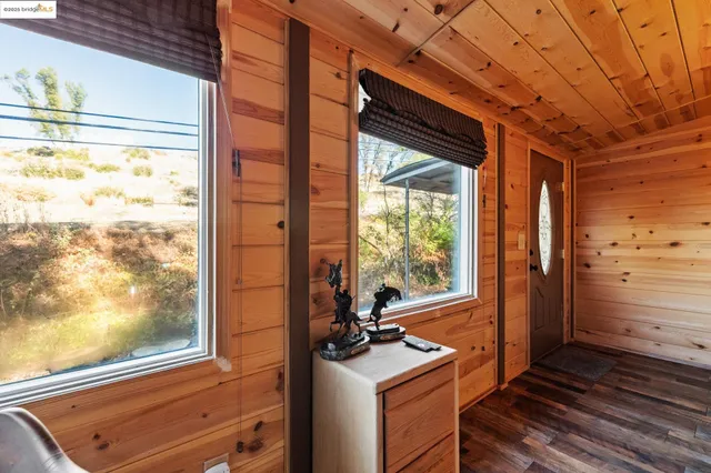 a view of a room with furniture and a chandelier