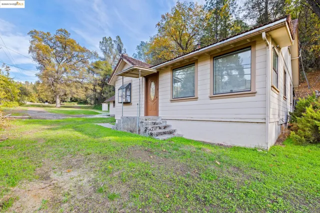a backyard of a house with lots of green space