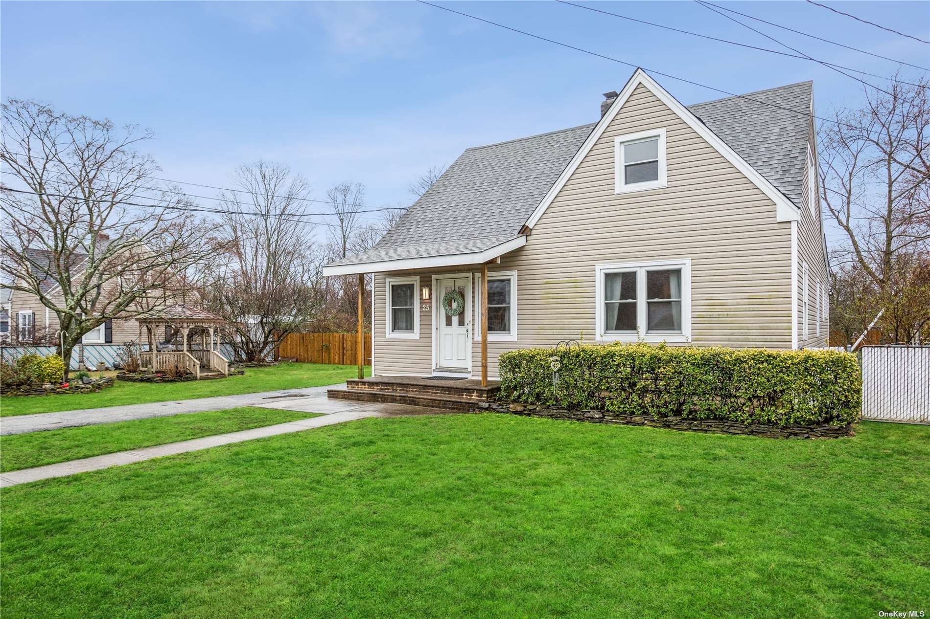 25 Second Avenue Central Islip, NY 11722 - Photo 1 of 1 a front view of house with yard and green space