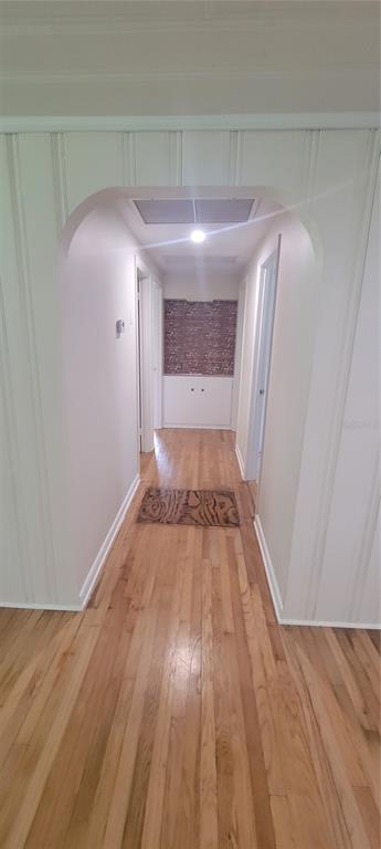 917 East 4th Avenue Mount Dora, FL 32757 - Photo 6 of 9 a view of empty room with wooden floor