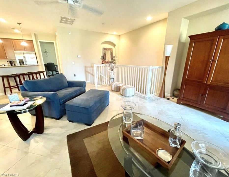 9050 Capistrano Street North, Unit 4102 Naples, FL 34113 - Photo 9 of 31 a living room with furniture