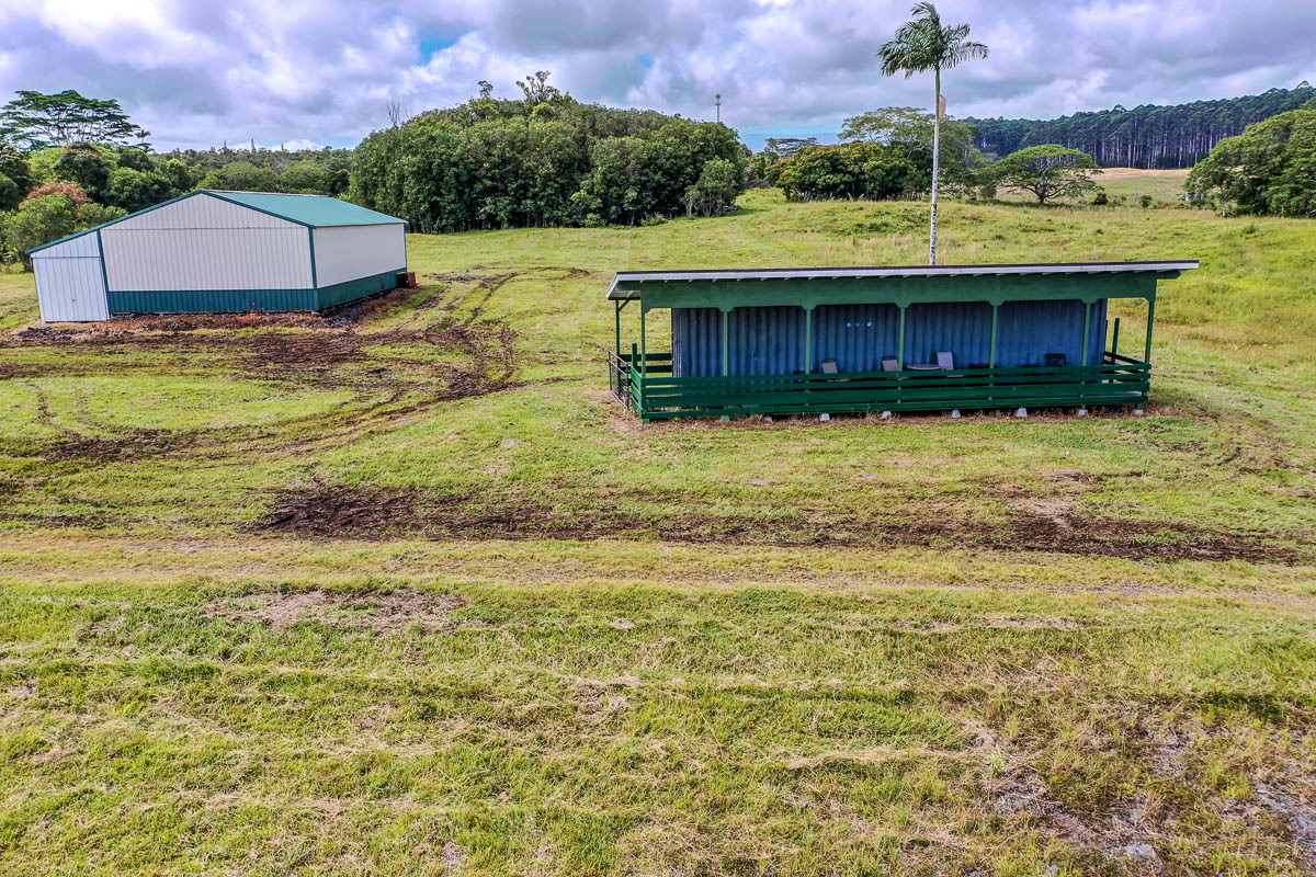 17-4870 Lot A South Road Mountain View, HI 96771 - Photo 14 of 29 a view of a house with a yard and a large pool