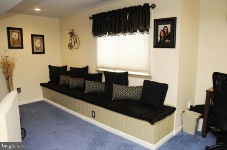 819 Sunny Chapel Road Odenton, MD 21113 - Photo 18 of 26 a living room with furniture and a flat screen tv