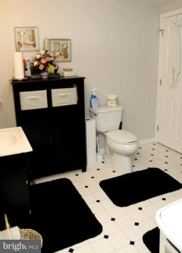 819 Sunny Chapel Road Odenton, MD 21113 - Photo 19 of 26 a bathroom with a sink a toilet and a shower
