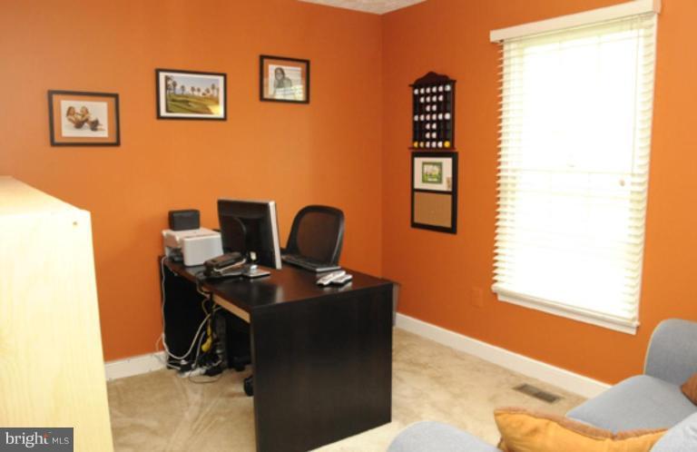 819 Sunny Chapel Road Odenton, MD 21113 - Photo 25 of 26 a view of a workspace with furniture and a window