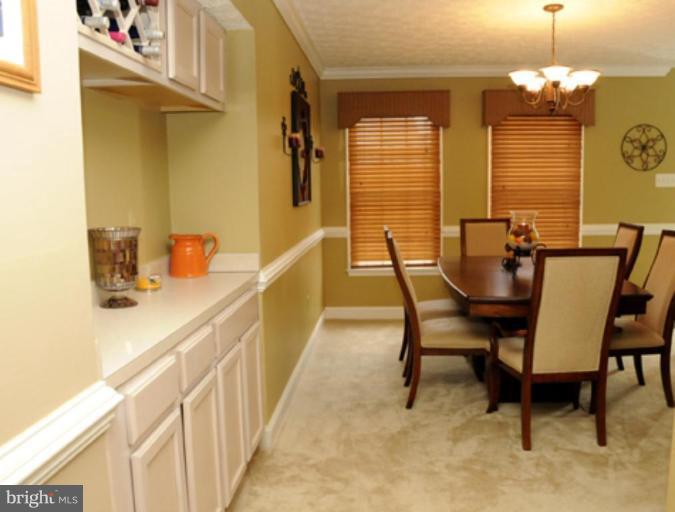 819 Sunny Chapel Road Odenton, MD 21113 - Photo 6 of 26 a dining room with furniture and chandelier