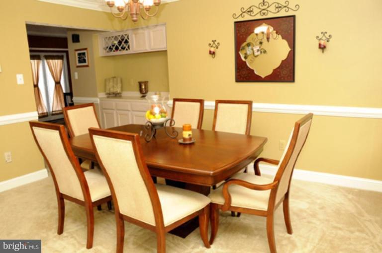 819 Sunny Chapel Road Odenton, MD 21113 - Photo 7 of 26 a view of a dining room with furniture and window