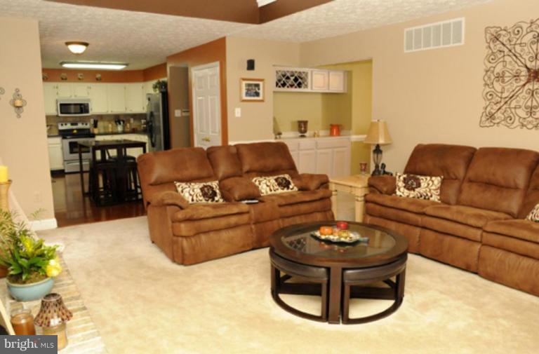 819 Sunny Chapel Road Odenton, MD 21113 - Photo 8 of 26 a living room with furniture and a couch