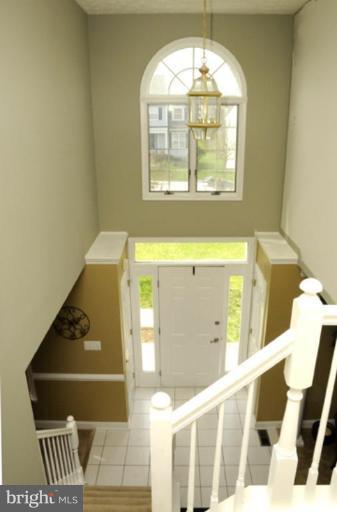 819 Sunny Chapel Road Odenton, MD 21113 - Photo 10 of 26 a view of a room with wooden floor and windows