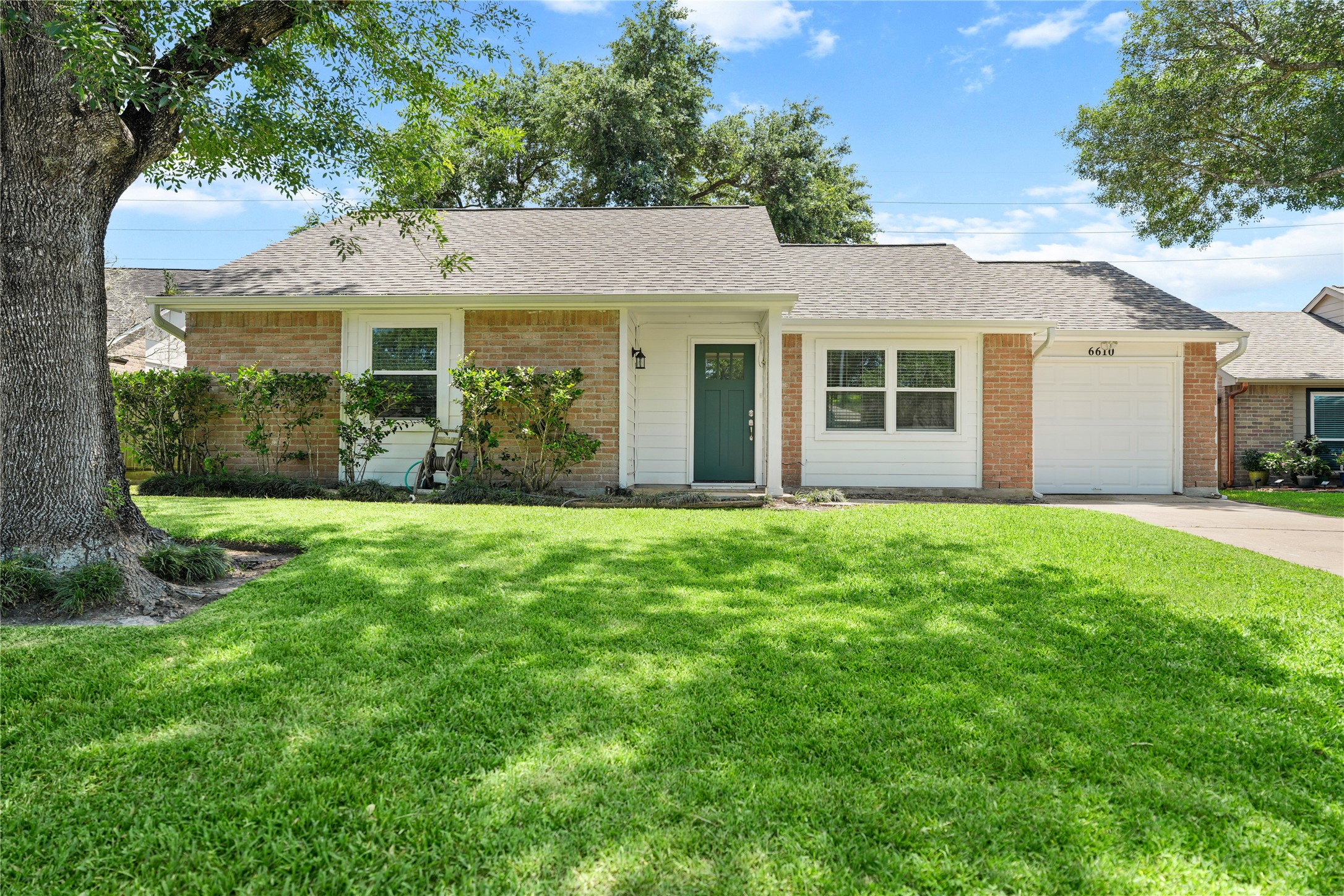 6610 Blue Ridge Drive Richmond, TX 77469 - Photo 1 of 24 This charming single-story home features a brick and siding exterior with a welcoming front porch. It has a large, well-maintained lawn and a single-car garage, offering a cozy and inviting curb appeal.