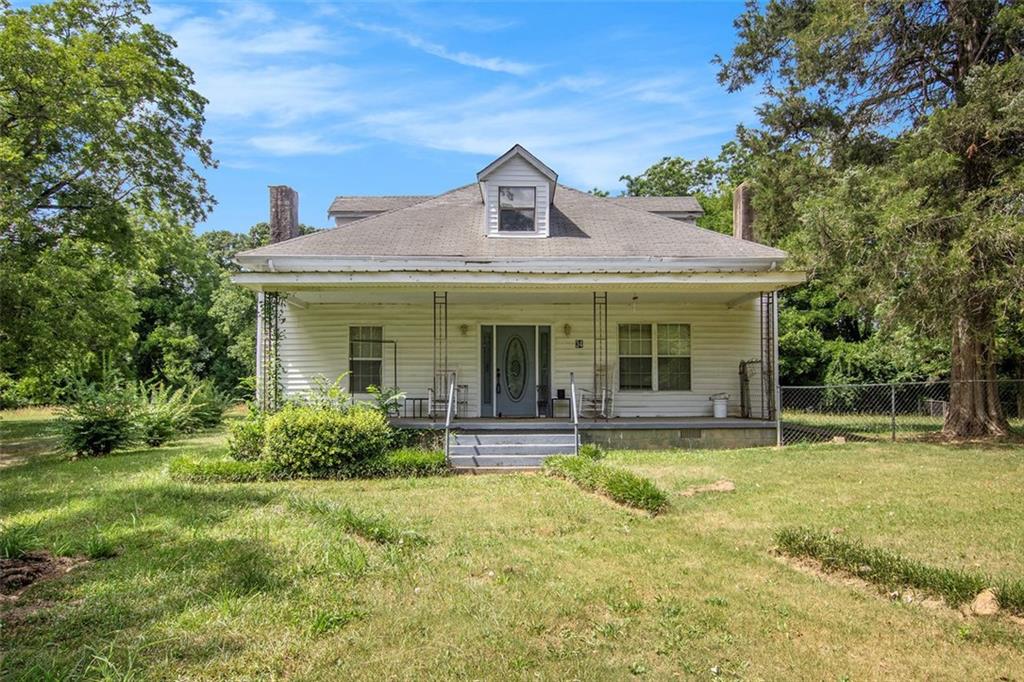 34 Parham Street Warm Springs, GA 31830 - Photo 1 of 1 a front view of a house with a yard