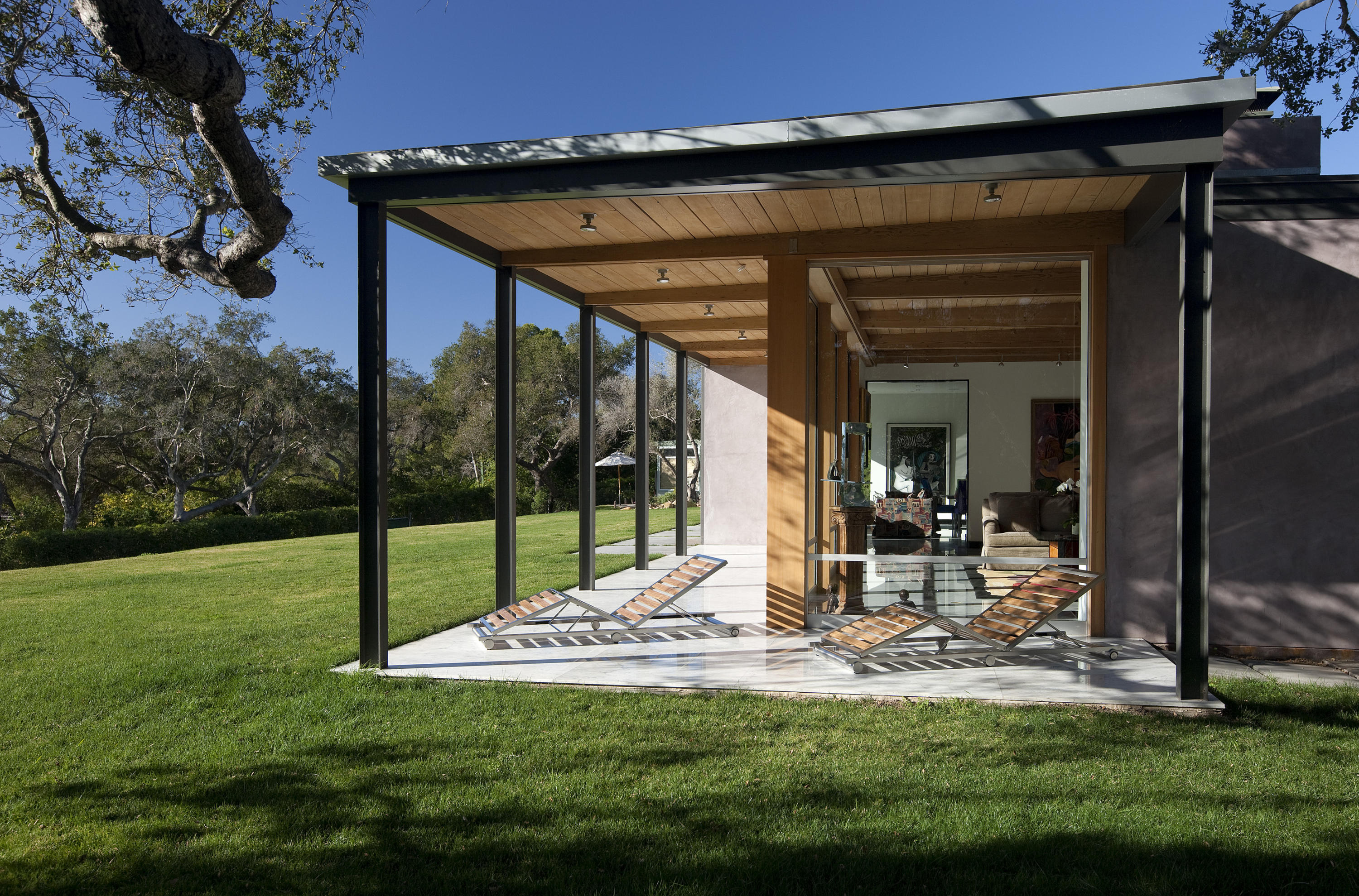 a view of a backyard with sitting area and slide