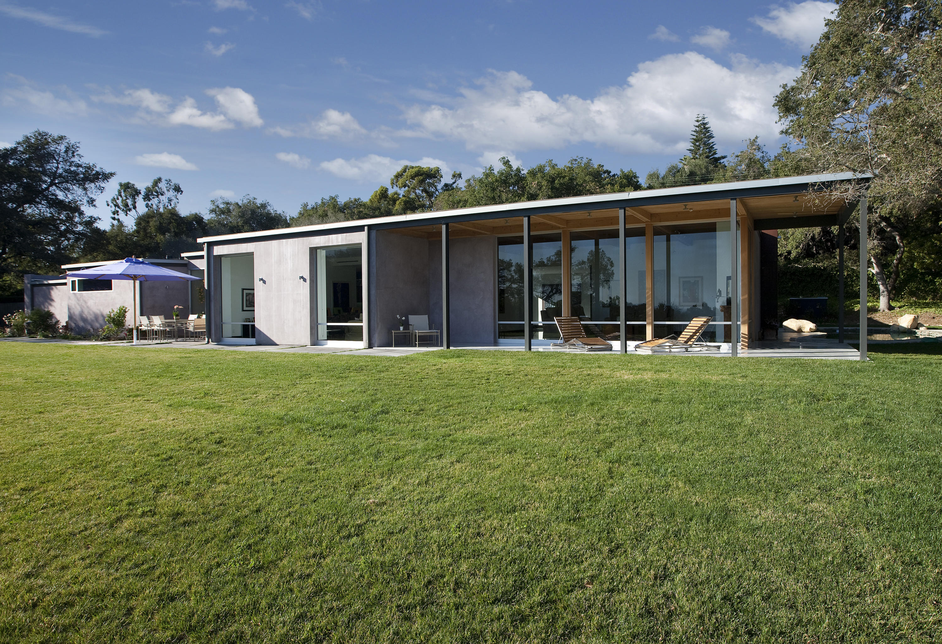 616 Hot Springs Road Santa Barbara, CA 93108 - Photo 16 of 26 a backyard of a house with table and chairs