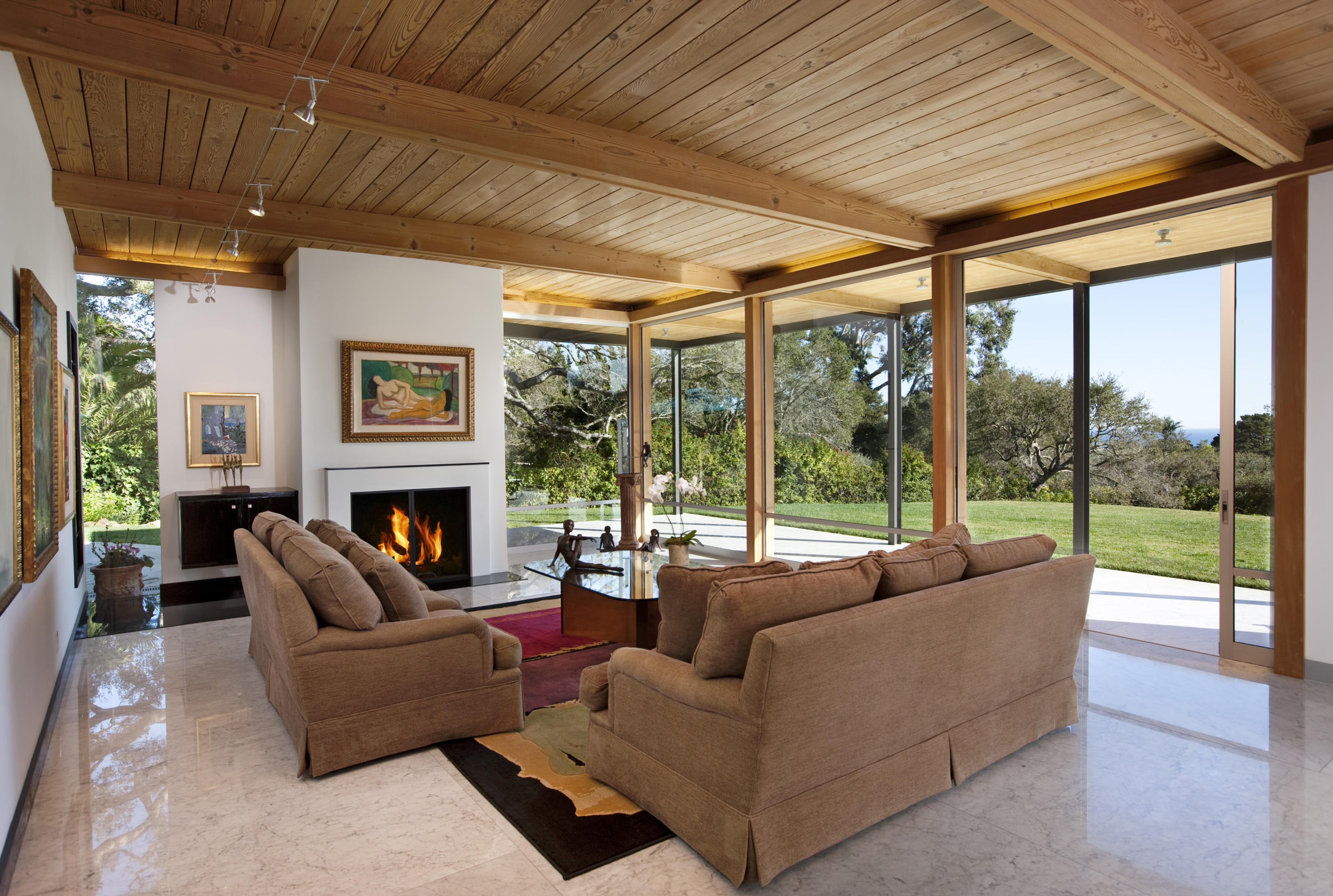 616 Hot Springs Road Santa Barbara, CA 93108 - Photo 18 of 26 a living room with furniture a fireplace and a large window