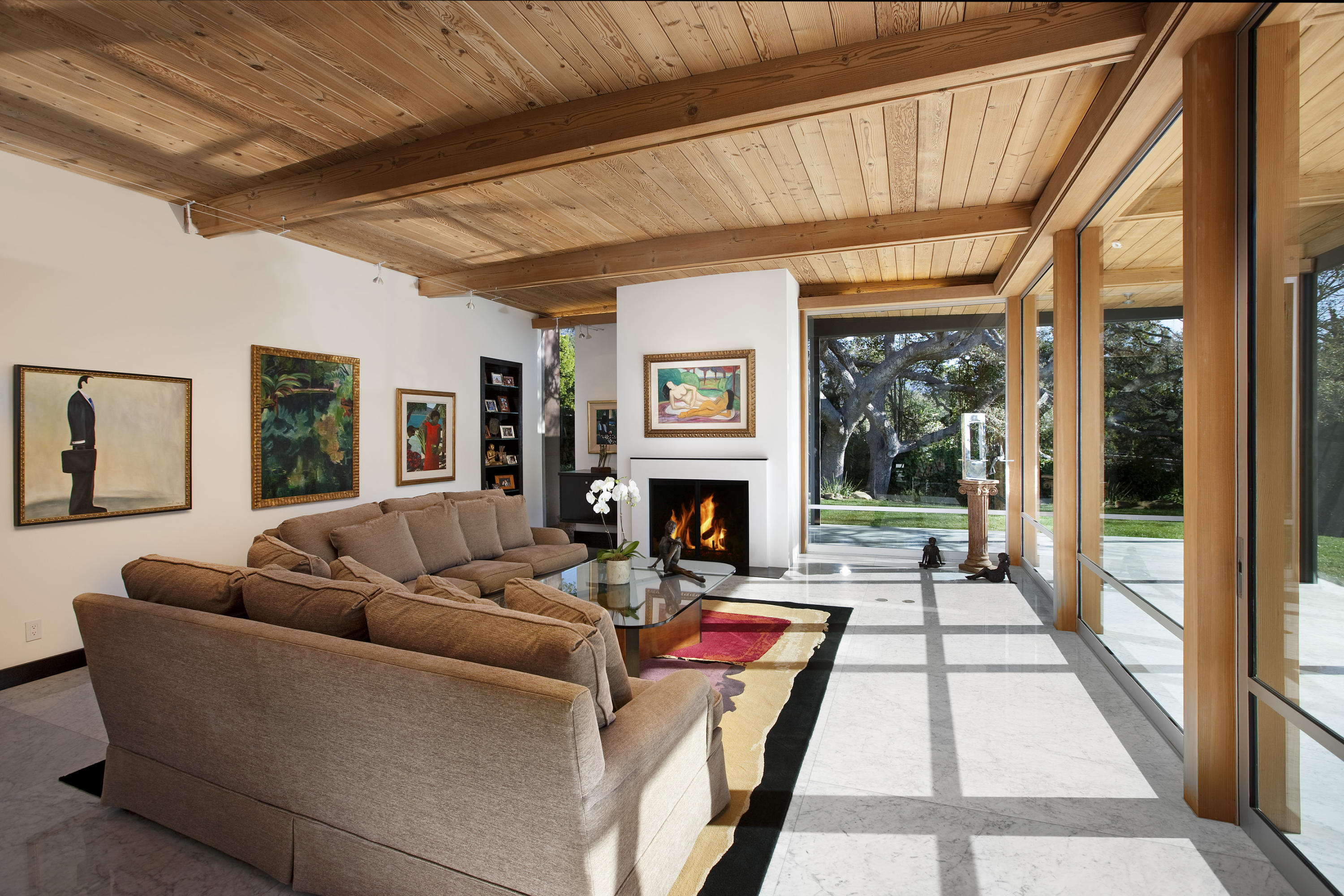 616 Hot Springs Road Santa Barbara, CA 93108 - Photo 24 of 26 a living room with furniture a large window and a fireplace