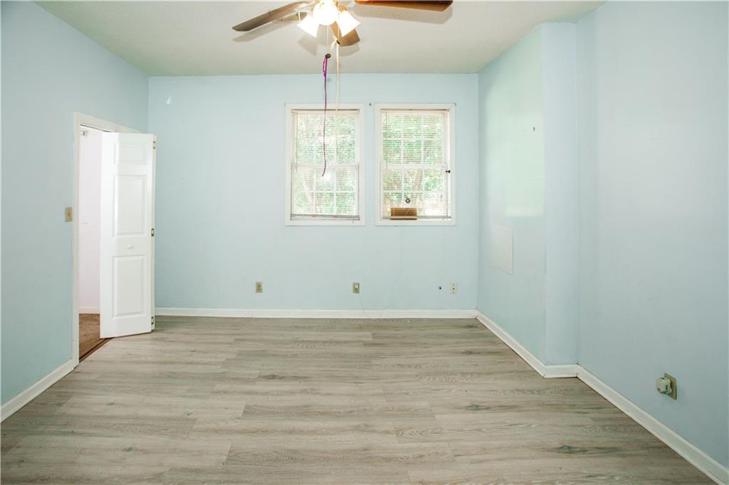 3831 Fairmont Avenue Macon, GA 31204 - Photo 15 of 29 wooden floor in an empty room with a window
