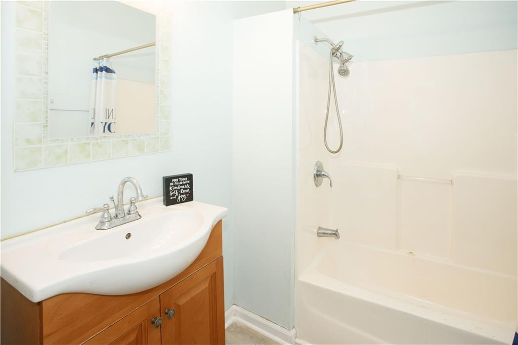 3831 Fairmont Avenue Macon, GA 31204 - Photo 21 of 29 a bathroom with a sink a shower and a mirror