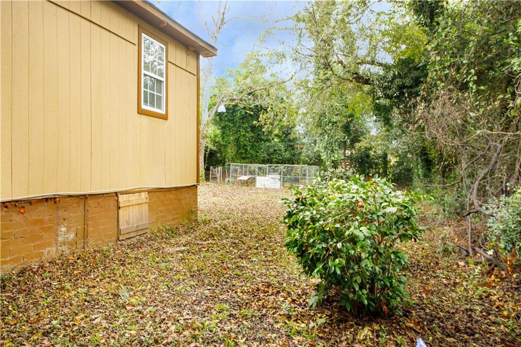 3831 Fairmont Avenue Macon, GA 31204 - Photo 28 of 29 a view of a pathway both side of house