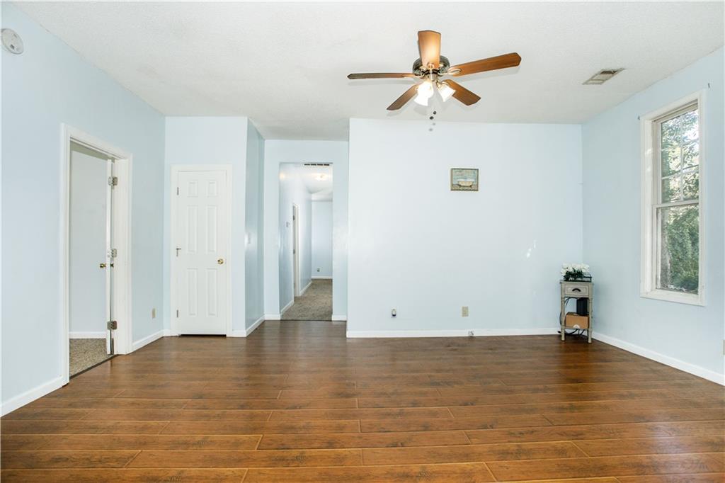 3831 Fairmont Avenue Macon, GA 31204 - Photo 9 of 29 wooden floor in an empty room with a window