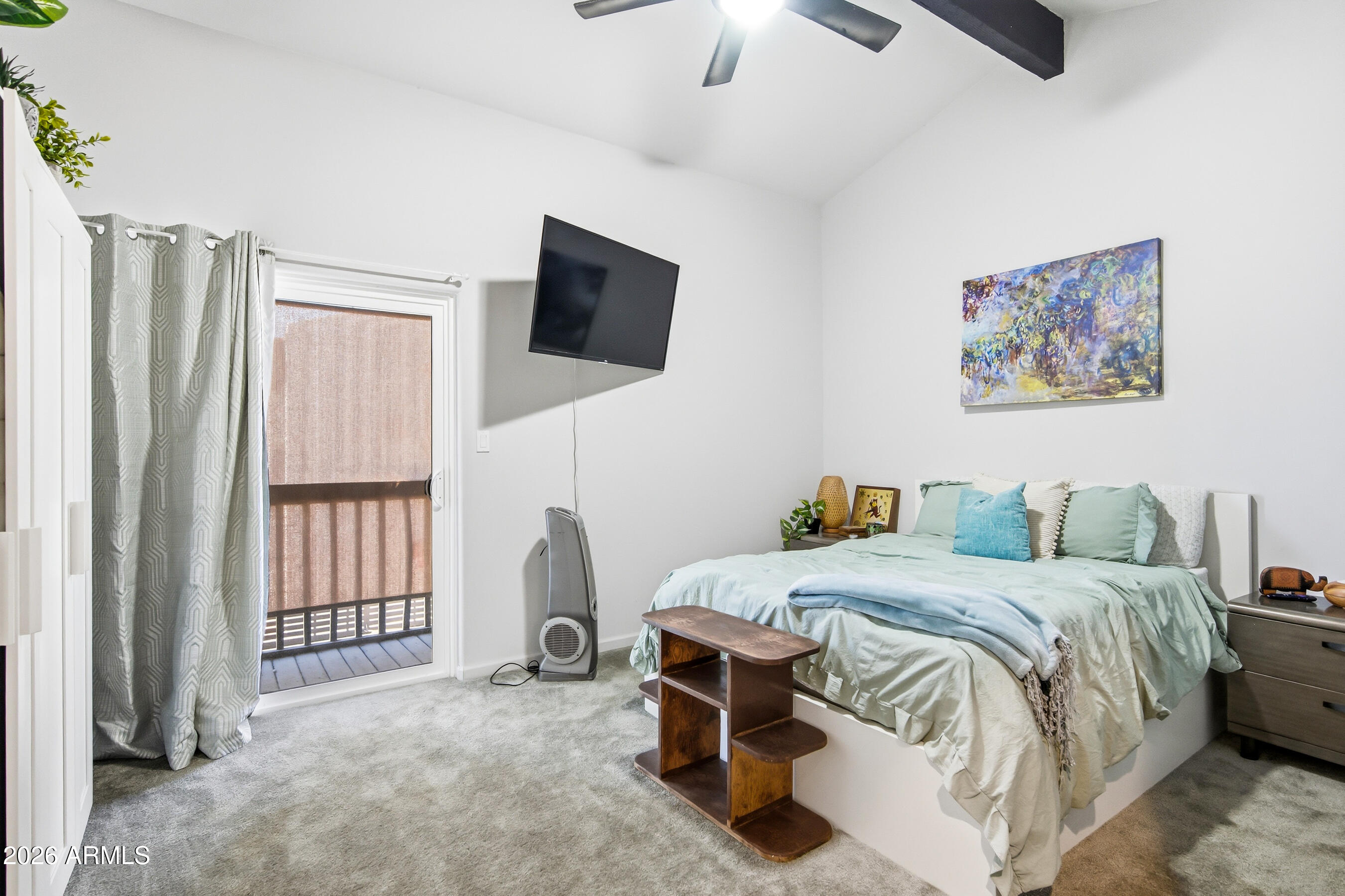 1702 East Ocotillo Road, Unit 1 Phoenix, AZ 85016 - Photo 16 of 27 a bedroom with a bed a flat screen tv and dresser