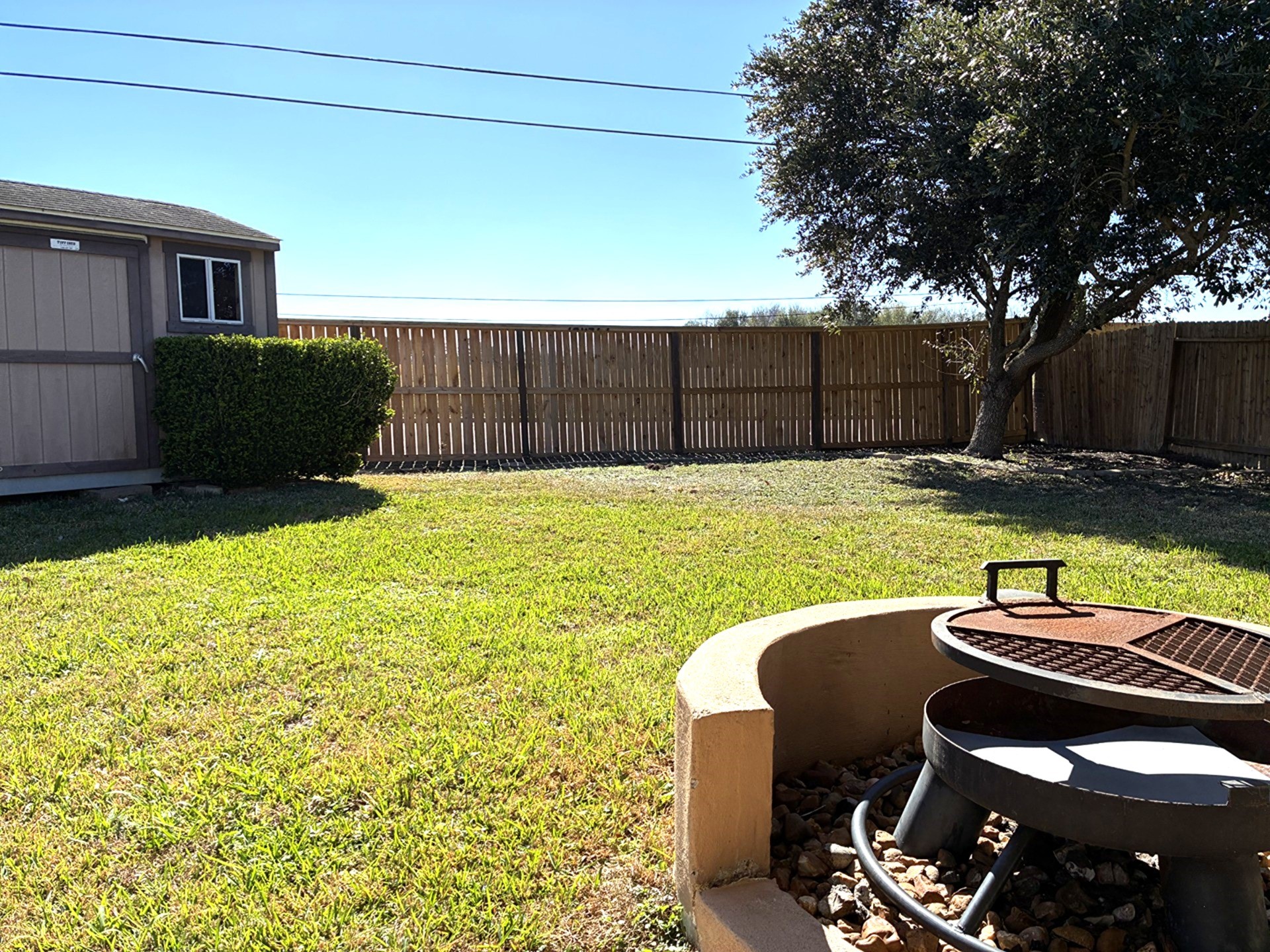3418 Cypress Landing Court Rosenberg, TX 77471 - Photo 20 of 23 a view of a backyard with table and chairs with wooden fence and plants