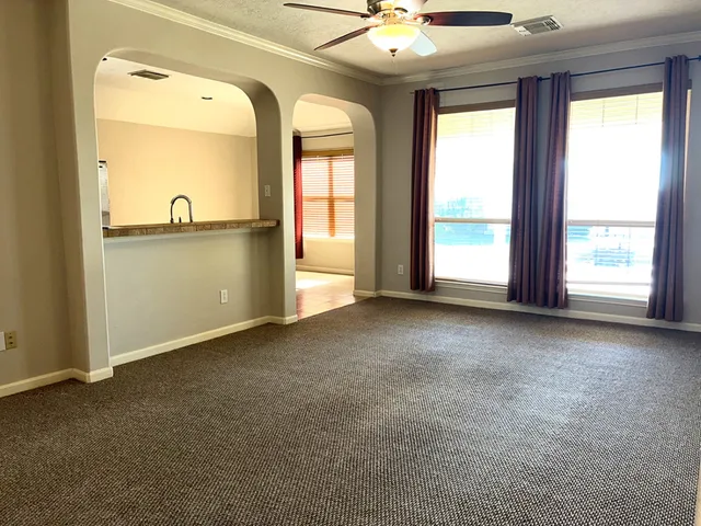 a view of a kitchen with a sink and a chandelier