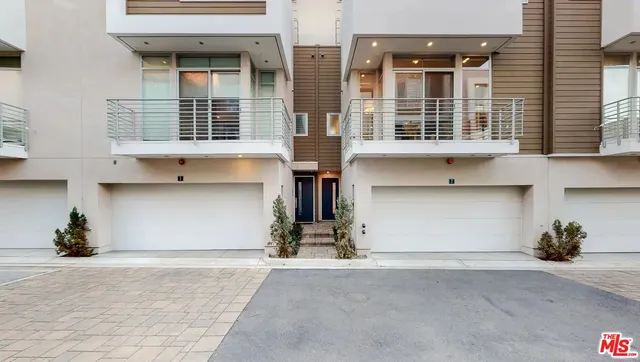 a front view of a building with many windows